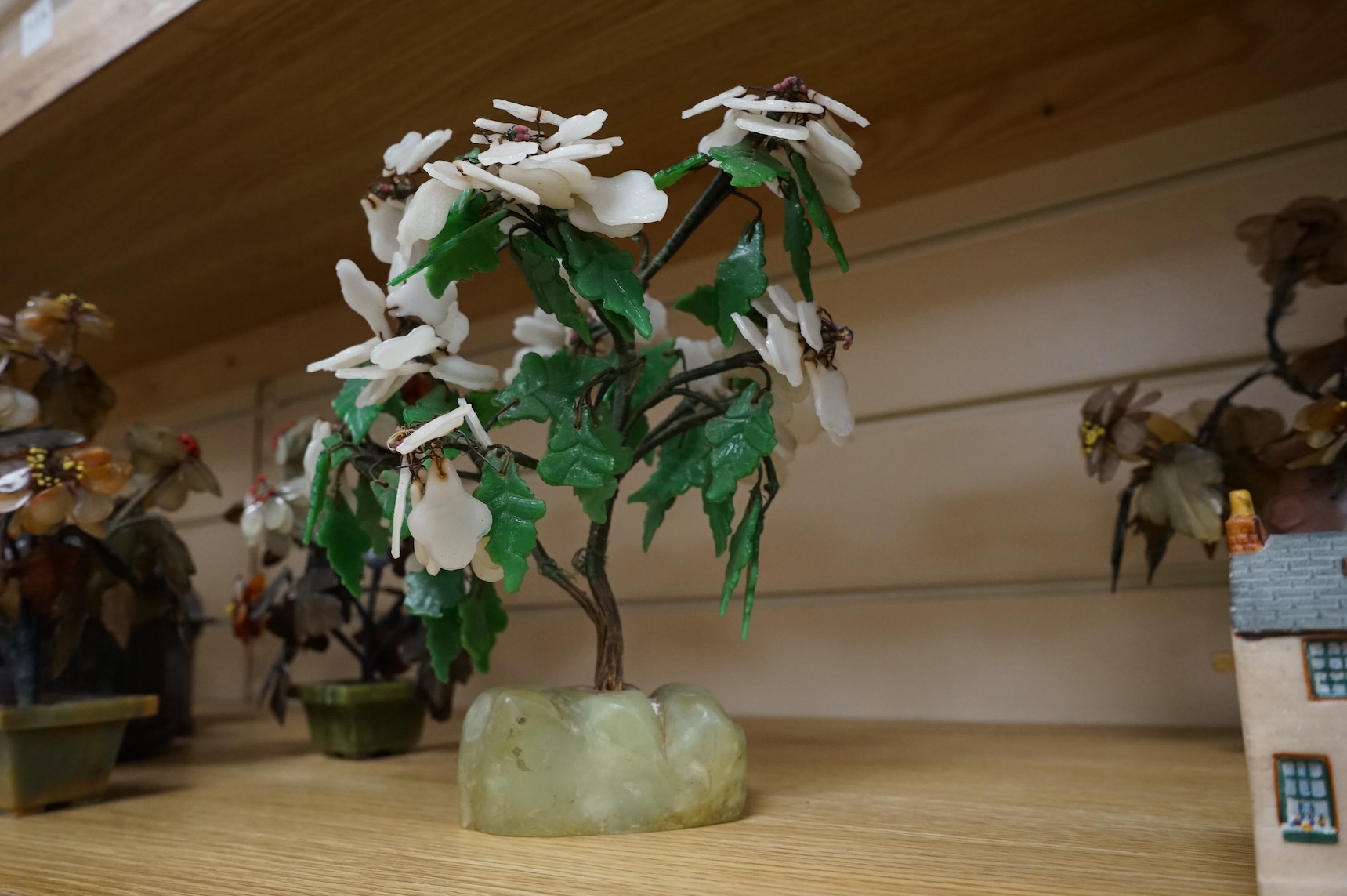 A collection of four ornamental Chinese hardstone flowering trees, tallest 22cm.